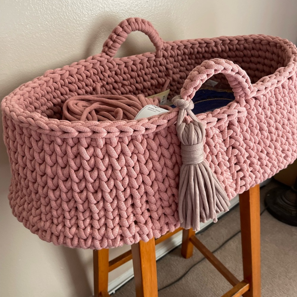 Antique pink baby bassinet